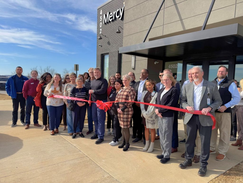 Group gathers for ribbon cutting