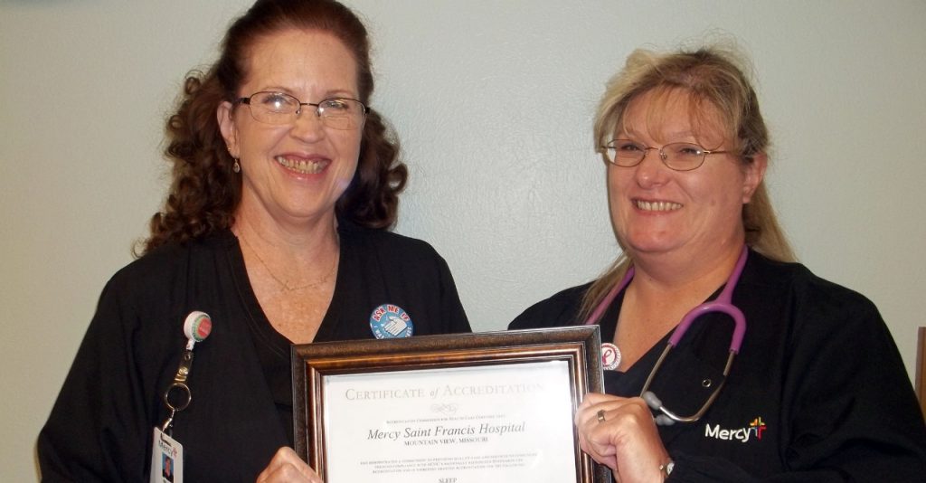 Sleep center manager Mirian Johnson (left) and sleep technician Annette Johnson display their sleep center accreditation certificate.
